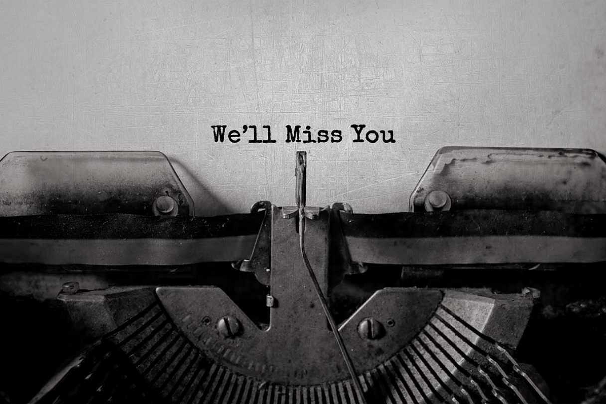 Paper in a typewriter with 'We'll Miss You' typed out